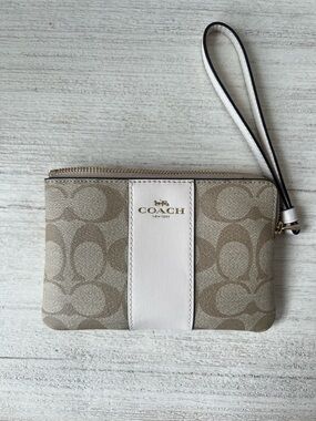 COACH Beige Signature Canvas Wristlet with White Stripe